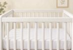 Illustration of an empty crib with bare rails and a fitted sheet.