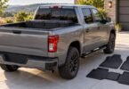 Generic unbranded pickup with a storage box and floor mats.