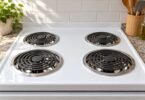 Generic electric coil stovetop with circular metal drip bowls.