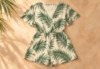 Generic cream romper with a green palm-leaf pattern laid flat.