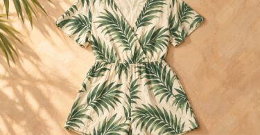 Generic cream romper with a green palm-leaf pattern laid flat.