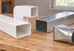 Generic rectangular ventilation duct sections and adapters on a workbench.