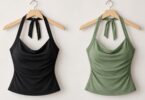 Generic black and sage-green halter tops on hangers.