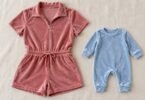 Generic rose adult velour romper and pale blue infant romper laid flat.