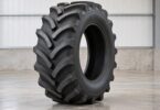 Generic agricultural tractor rear tire with angled traction lugs.