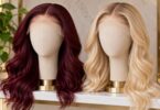 Generic burgundy and blonde lace-front wigs on display stands.