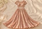 Generic separate rose-gold sequin crop top and long skirt laid flat.