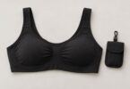 Generic black bra laid beside a separate empty fabric carry pouch.