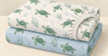 Illustration of two folded fitted crib sheets with green turtle prints.