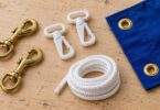 Generic brass and nylon flag clips beside rope and a blue fabric corner with grommets.
