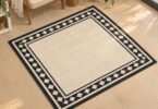Illustration of a square black-and-ivory rug in a reading corner.