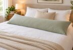 A generic long rectangular body pillow on a bed.