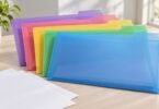Generic translucent colored top-tab file folders and blank documents on a desk.