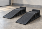 Illustration of two empty low-rise wheel ramps on a level garage floor.