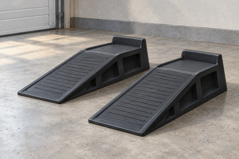 Illustration of two empty low-rise wheel ramps on a level garage floor.