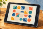 Watercolor illustration of a generic older tablet displaying a grid of colorful geometric puzzle tiles.