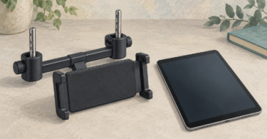 Illustration of a generic tablet holder with headrest-post clamps beside a blank-screen tablet.