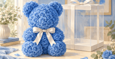 Illustration of a blue rose-shaped bear with a white bow beside an empty clear gift box.