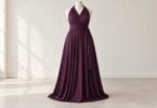 Unbranded plum convertible-style gown with wrapped fabric panels on a neutral dress form