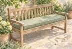Illustration of a wooden garden bench with a sage rectangular cushion and a measuring tape on the patio.