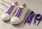 Illustration of unbranded cream sneakers with purple laces beside flat and round purple shoelaces