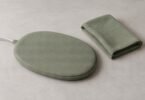 Generic fabric-covered pet warming pad with a folded cover on a tabletop