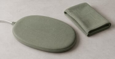 Generic fabric-covered pet warming pad with a folded cover on a tabletop
