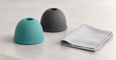 Illustration of smooth silicone accessories beside a soft cleaning cloth