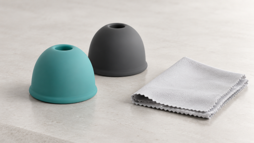 Illustration of smooth silicone accessories beside a soft cleaning cloth