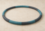Illustration of a thick segmented exercise hoop lying unused on the floor.