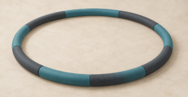 Illustration of a thick segmented exercise hoop lying unused on the floor.