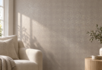 Fine glitter catches daylight on a pale taupe accent wall beside a cream chair and wooden side table.