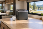 Unbranded countertop ice maker and a glass of ice on an open RV kitchen counter