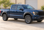 Illustration of an unbranded blue crew-cab pickup with black front and rear fender flares, parked outside a workshop.