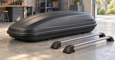 Conceptual illustration of a closed roof cargo box with two detached crossbars on a workshop floor.