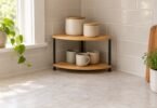 Unbranded two-tier corner shelf holding cups and lidded jars on a kitchen counter