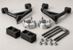 Generic unbranded suspension components, including control arms, strut spacers, rear blocks, U-bolts and nuts, on a neutral background