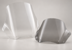 Two unbranded touring motorcycle windshields, one tall and clear and one shorter with a light gray tint, on a neutral studio background