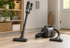 Unbranded dark gray stick and portable canister vacuums on a wooden utility-room floor