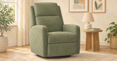 Illustration of an empty sage-green adult glider chair beside a wooden table and lamp.