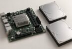 Illustration of a compact motherboard beside two storage drives