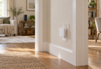 Generic Wi-Fi extender in a hallway between a living room and home office